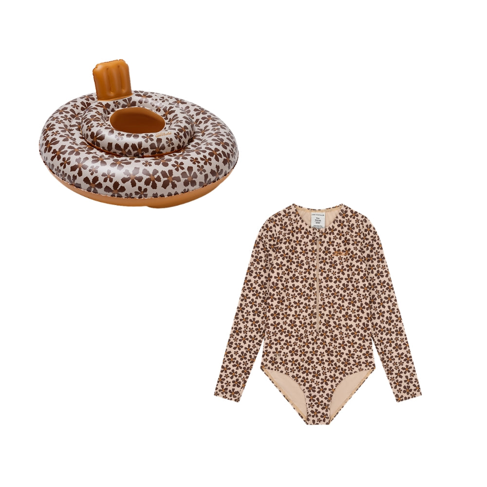 This is a set comprising a baby float and a long-sleeved swimsuit for girls. The baby float features a wildflower print and a beige top adorned with brown flowers. The bottoms and neck support are brown. The long-sleeved swimsuit for girls is beige with brown flowers. The lining is beige. This is shown on a white background.