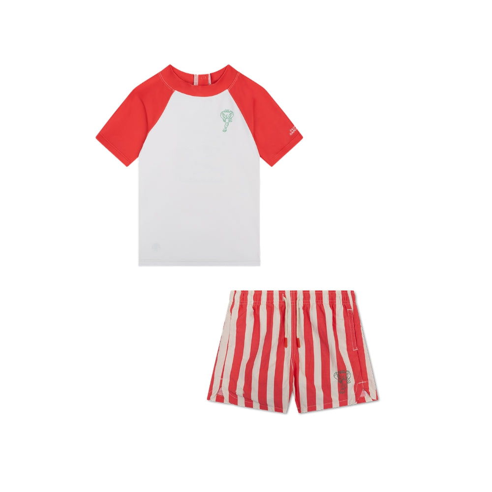 Red and white children’s swimwear set, comprising a shirt and swim short. The shirt is white with red sleeves. A lobster is depicted in the top left-hand corner. The swimming shorts are red with white stripes, featuring a lobster in the bottom left-hand corner. The background is white.