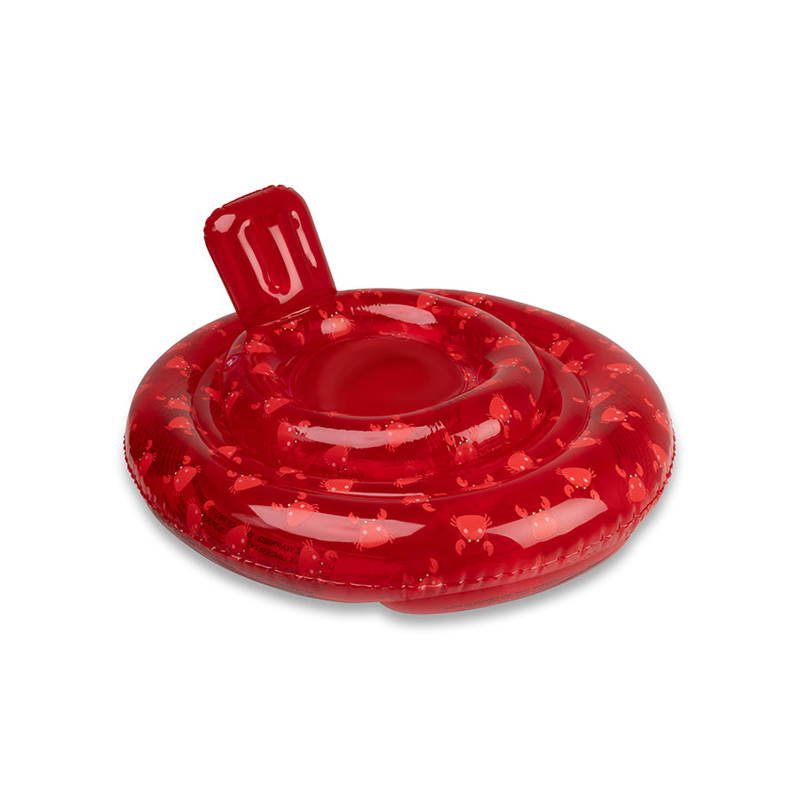 Transparent red baby float with a crab print. The baby swim ring features a neck support against which the baby can rest its head. The background is white.