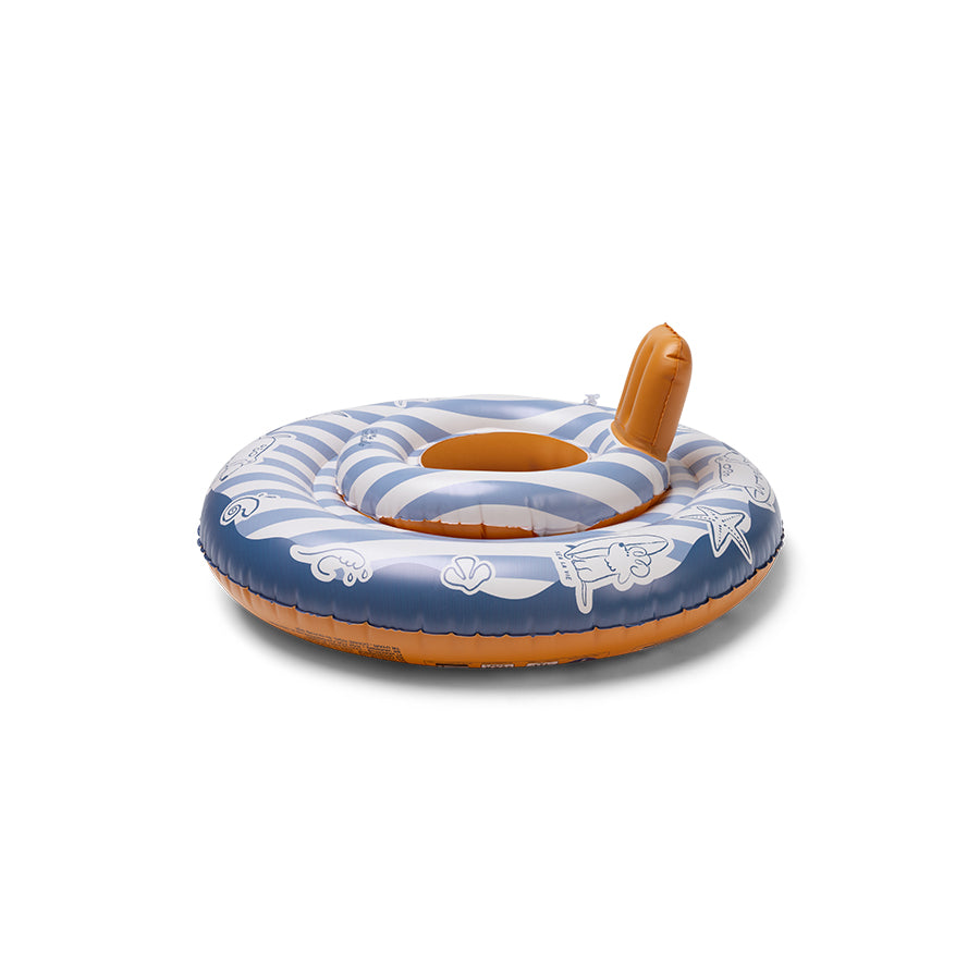 The side of an inflatable baby float featuring a blue and white striped pattern and cartoon characters. The swim ring has a brown bottom and a small ‘Swim Essentials’ logo on it on a white background.