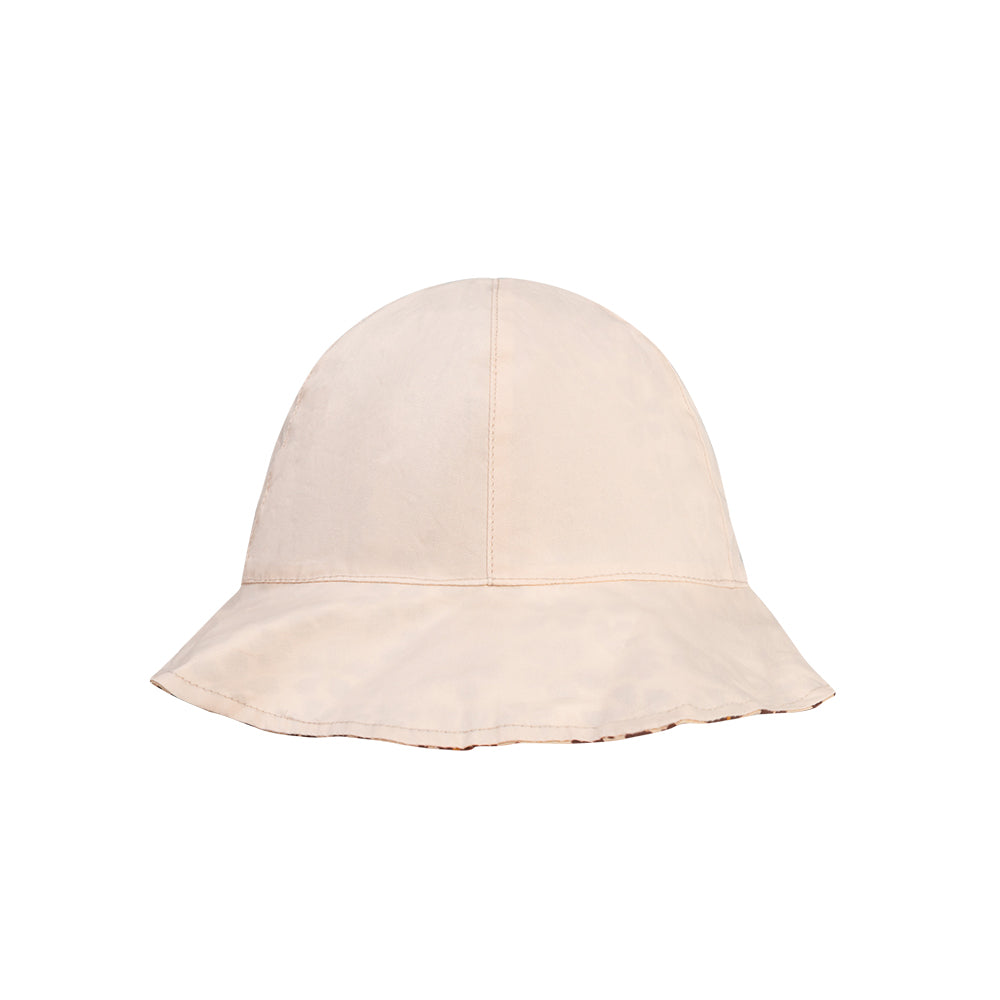 Reverse of the bucket hat in beige on a white background