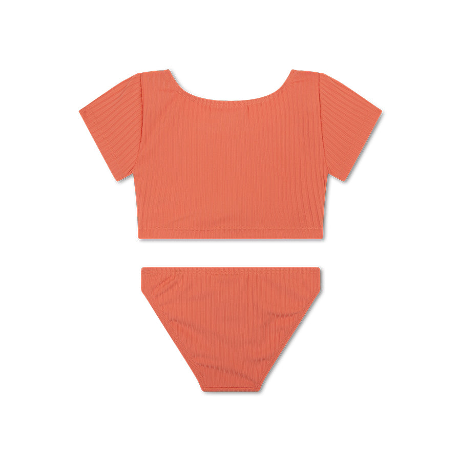 The back of a orange bikini set on a white background