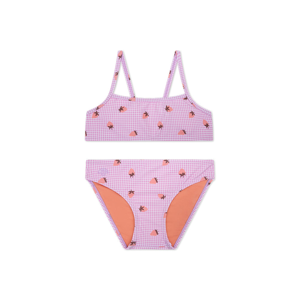 Pink checkered bikini set with orange accents and strawberries on it on a white background
