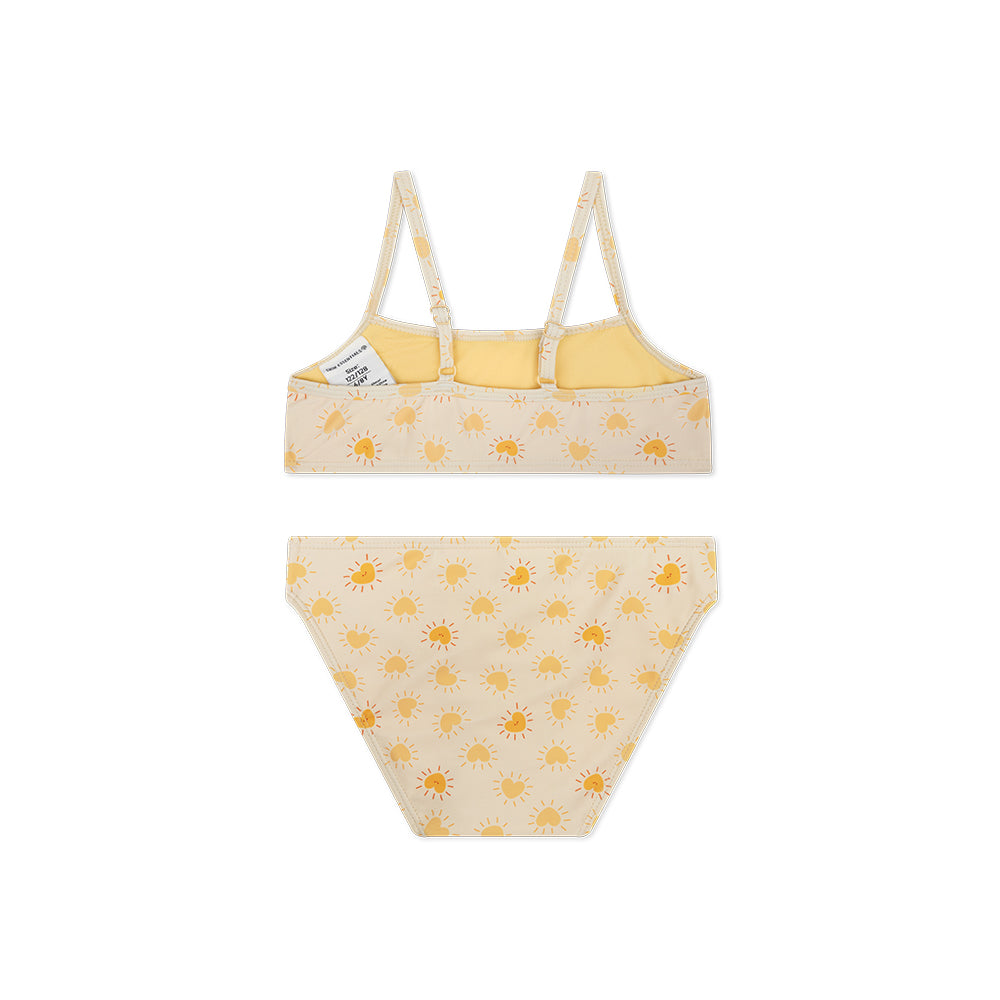 The back of a bikini with sun pattern on a white background