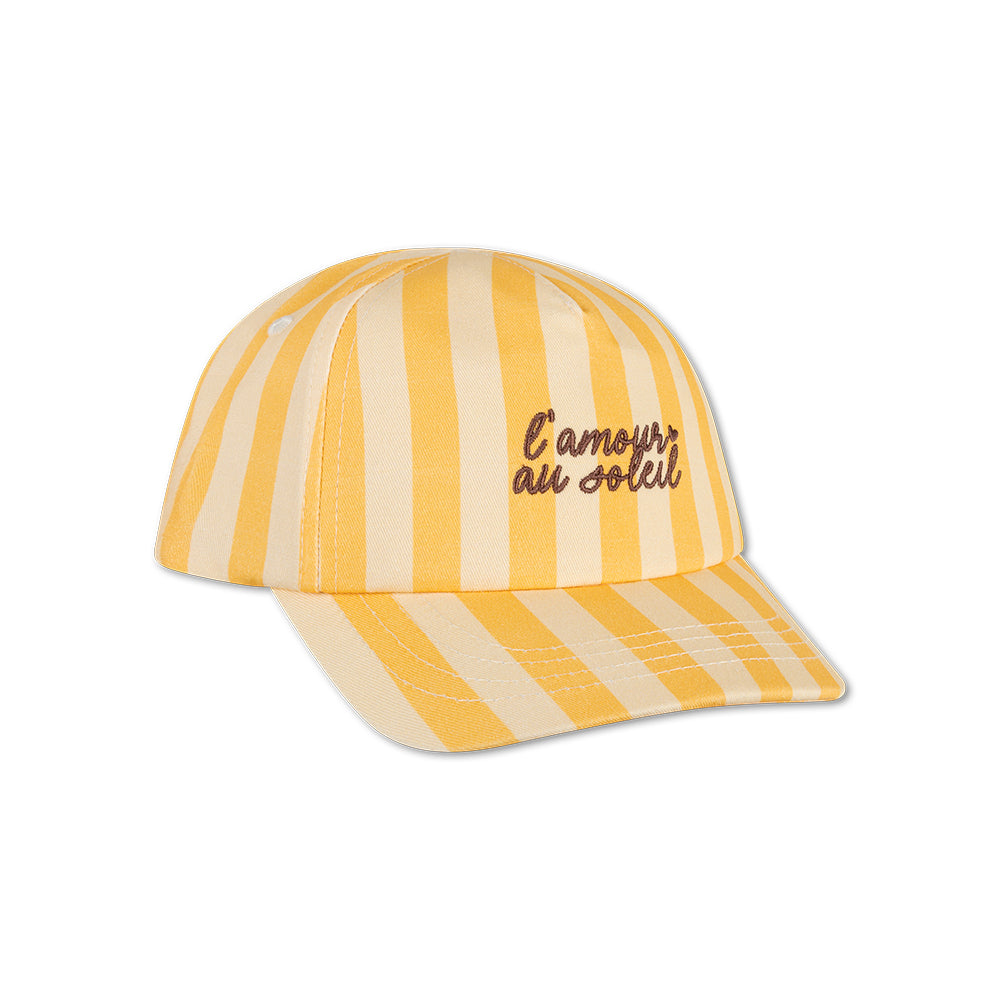 Yellow and beige striped cap with text: "L'amour au soleil" on a white background