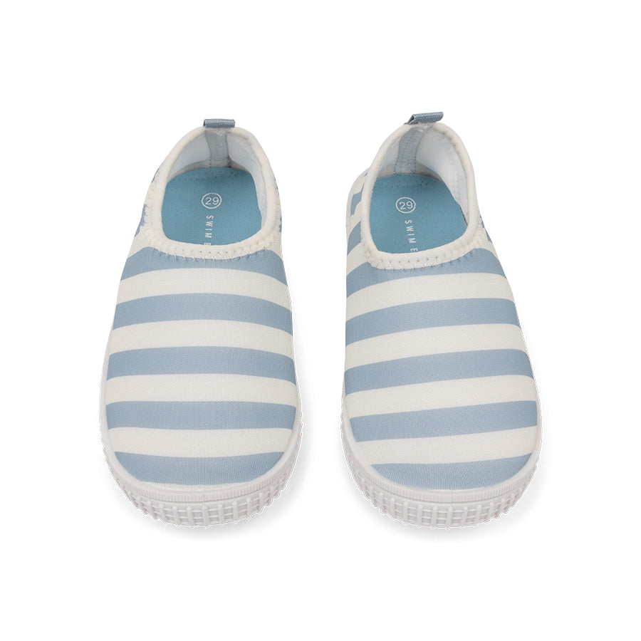 Pair of blue and white striped water shoes on a white background