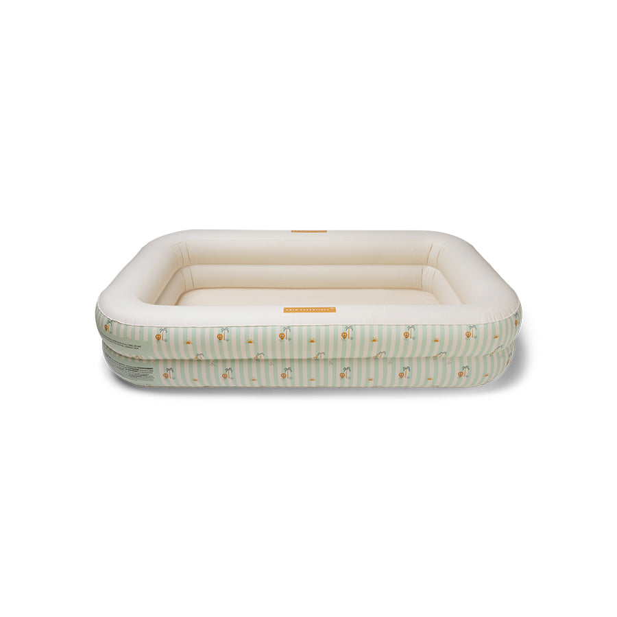 Inflatable pool with green and white stripes and a jungle pattern on it on a white background