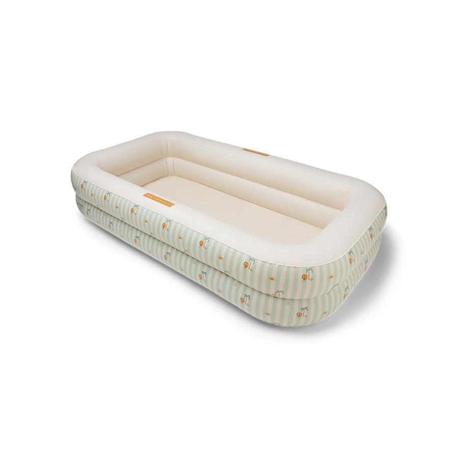 Inflatable pool with green and white stripes and a jungle pattern on it on a white background