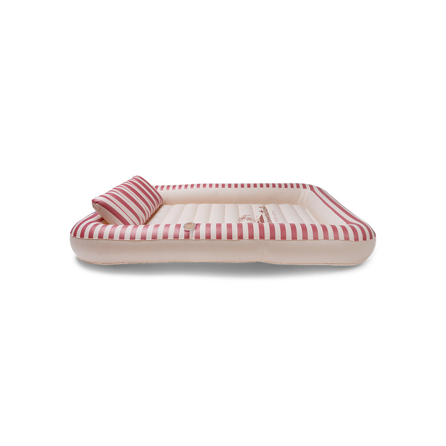 The side of an inflatable tanning pool with a red and beige striped pattern, the Swim Essentials logo in the centre and a neck support on a white background