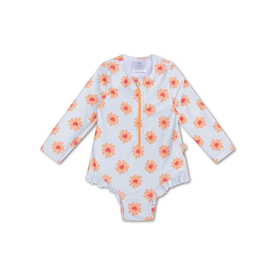 Floral-patterned kids swimsuit, with long sleeves, a zip and ruffles on a white background