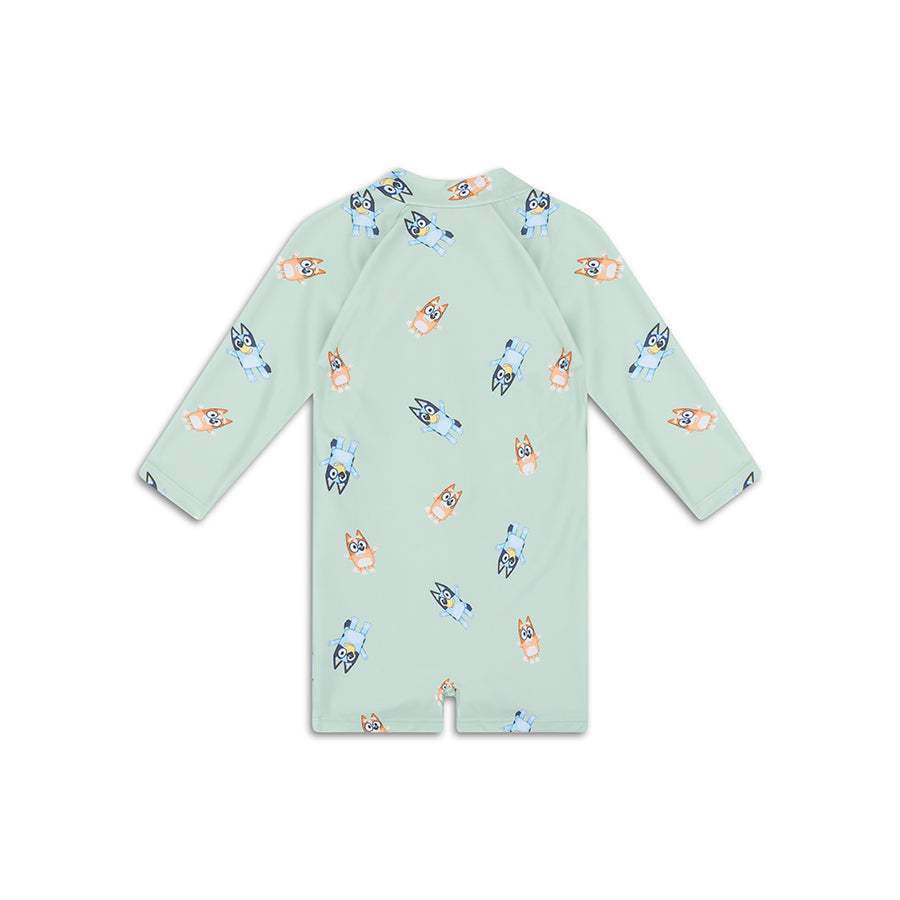 The back of a Light green swimuist with cartoon character pattern on a white background