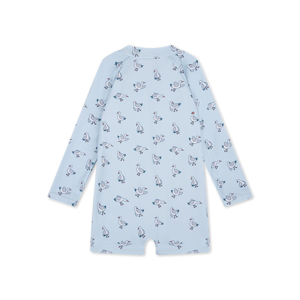 The back of a light blue swimuit with seagull
pattern on a white background