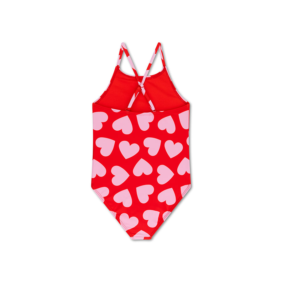 Red swimsuit with pink heart pattern on a white background