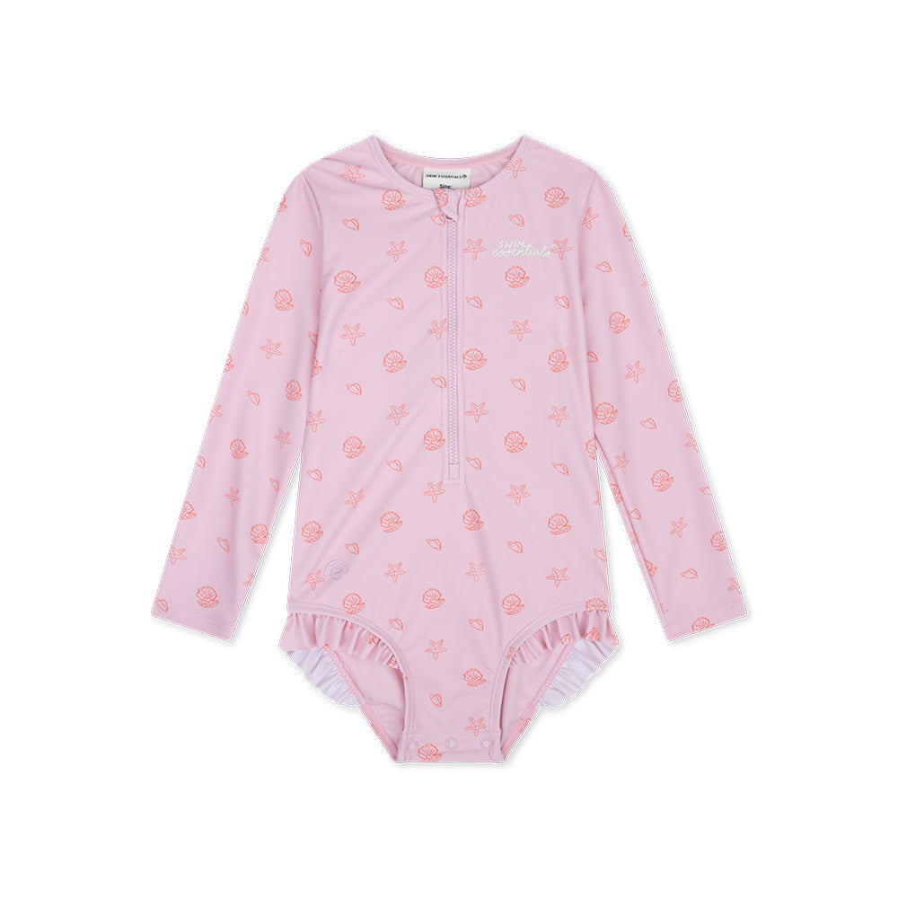 Pink Shell Tastic girls swimsuit with long sleeves with a seashell-pattern with a zip, ruffles and the swim essentails logo on a white background.