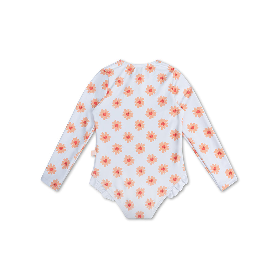 The back of a white swimsuit with orange floral pattern and ruffles on a white background.