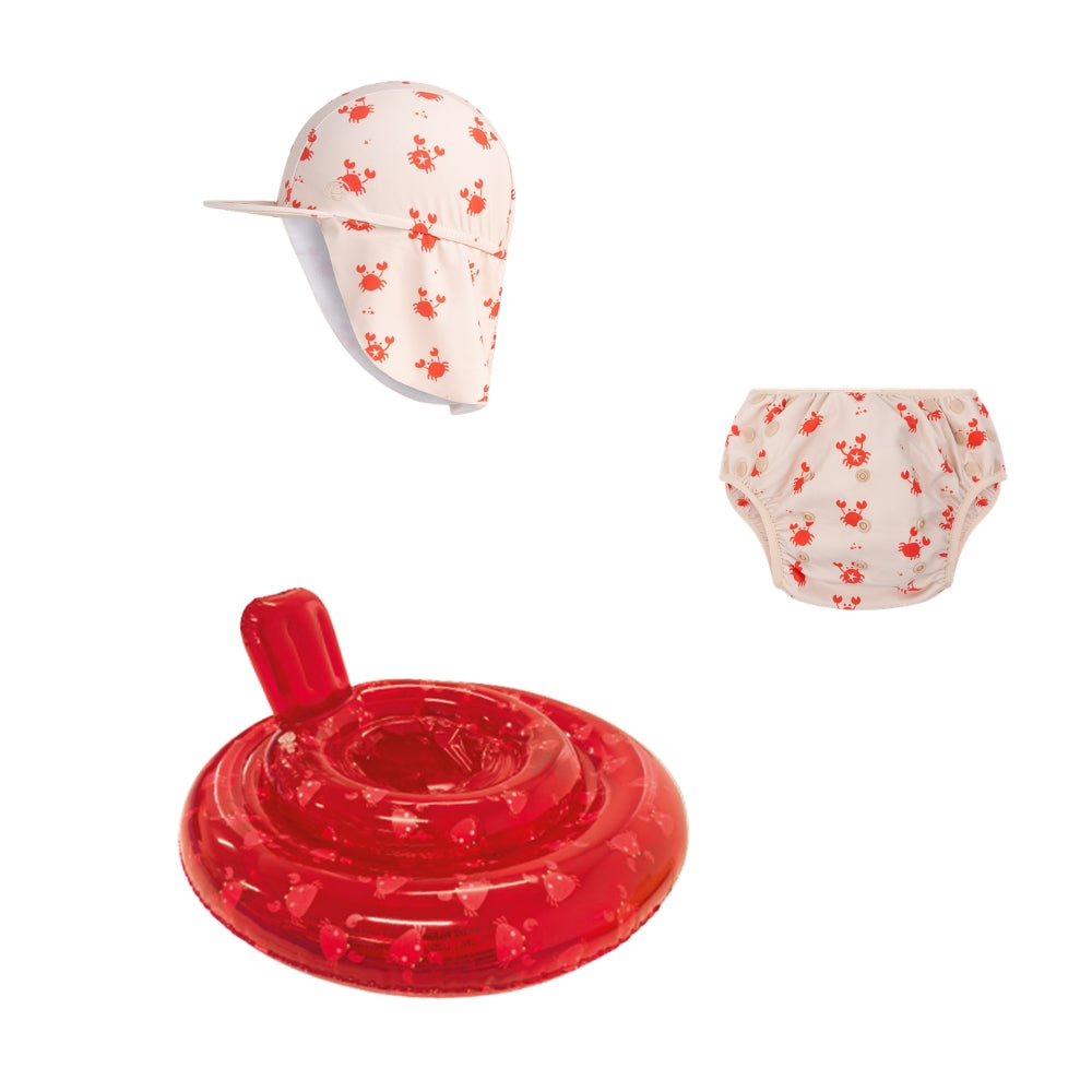 This is a set comprising a sun hat, a diaper and a baby float. The sun hat is beige with a neck flap and is decorated with red crabs. The diaper is beige with red crabs, and the baby float is transparent red with red crabs on it. The background is white. 
