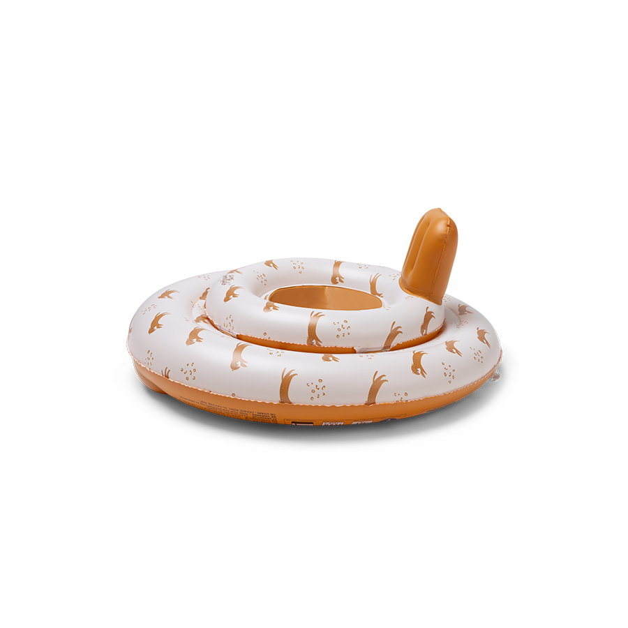 The side of the baby float features the ‘Roamer’ print. The top is beige with a tiger and paw print. The bottom and neck support of the baby float are brown. 