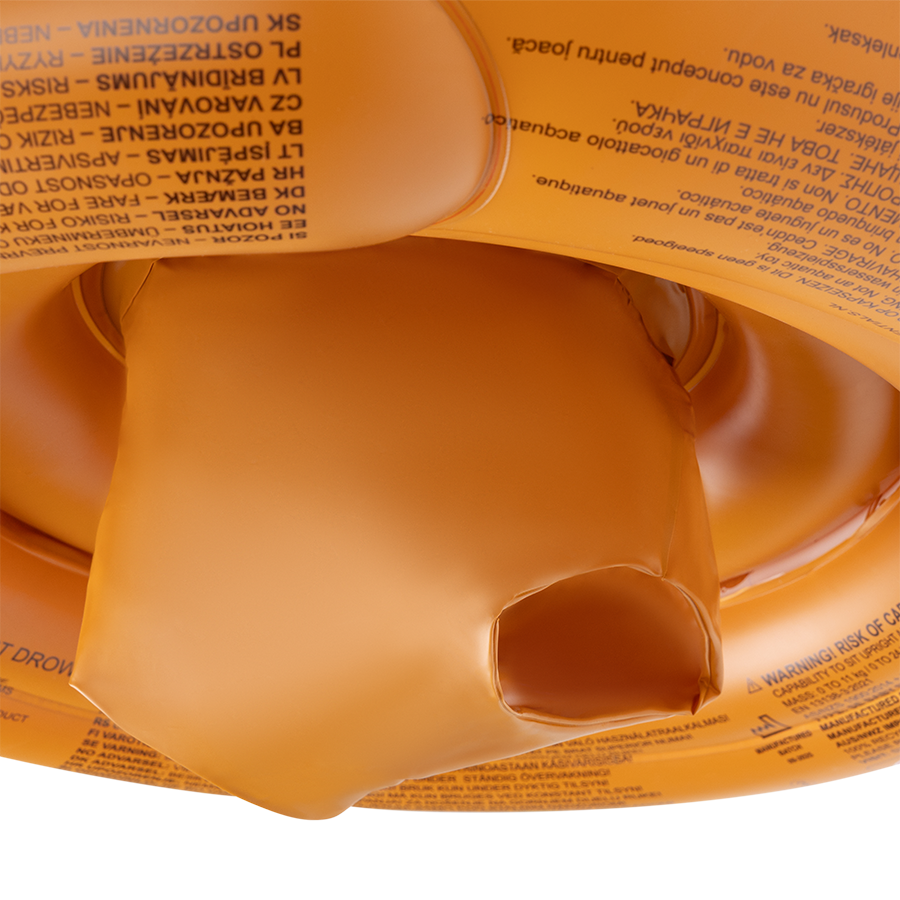 Close-up of a brown baby float with warning text on it, on a white background.