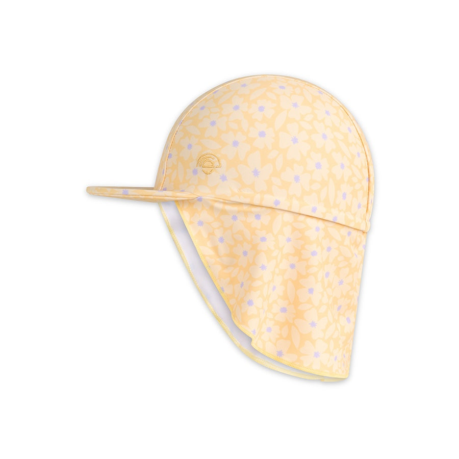 Yellow baby hat with purple and yellow flowers dots on a white background