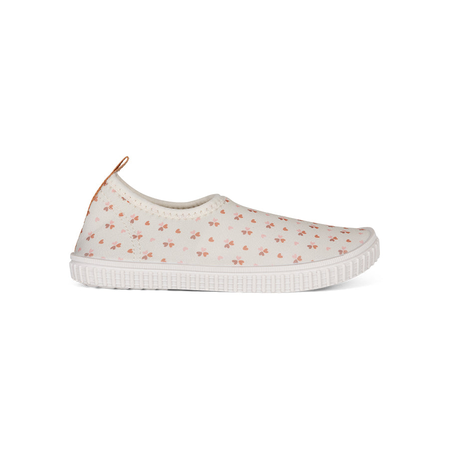 White slip-on watershoe with floral pattern on a white background