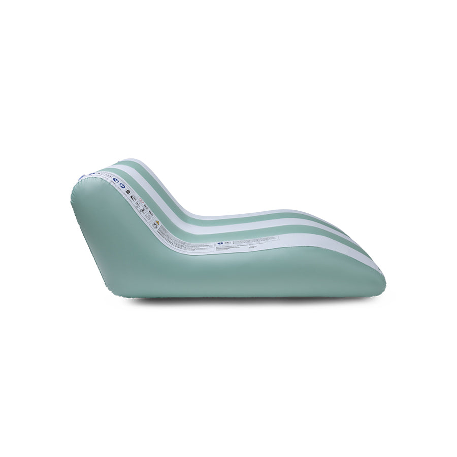 The side of the mint green and white striped luxe lounge on a white background