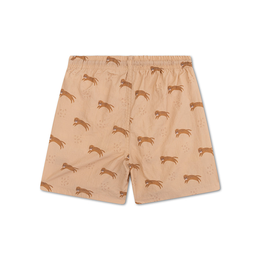The back of a beige swim shorts with animal pattern on a white background