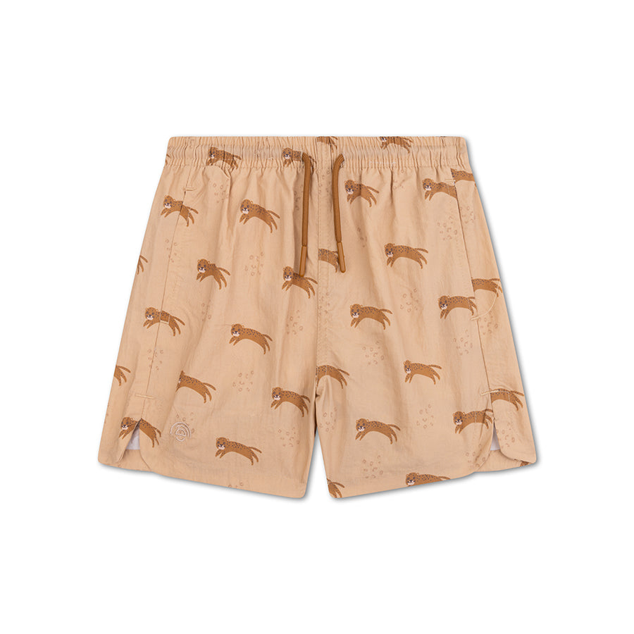 Beige swim shorts with animal pattern on a white background