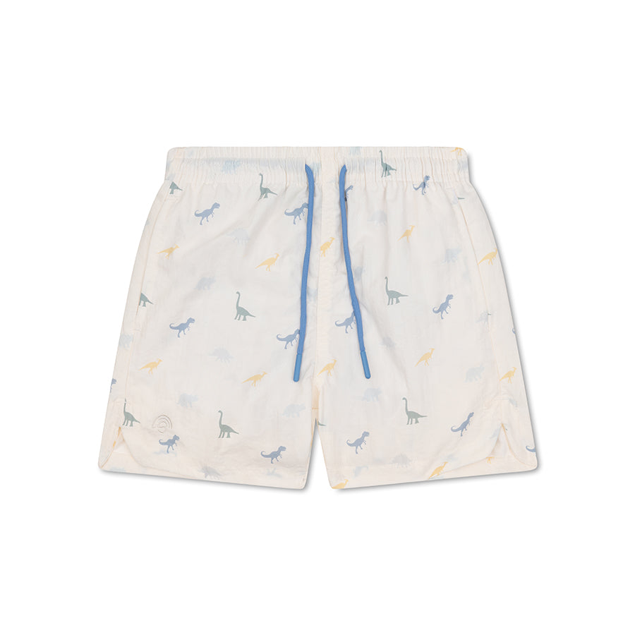 White swim shorts with dinosaur pattern on a white background