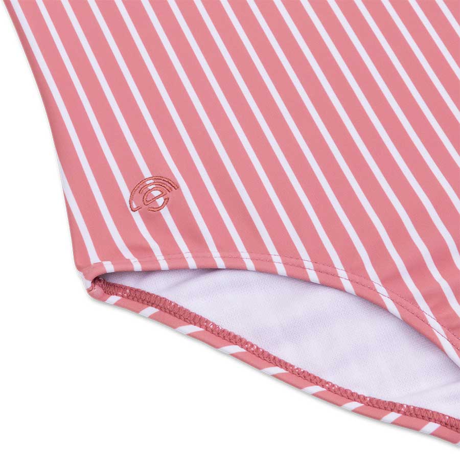 Close-up of a pink and white striped fabric with a logo on a white background