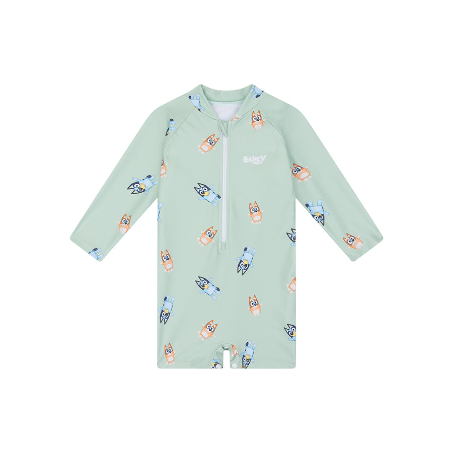 Light green children's swimsuit with cartoon dog pattern on a white background