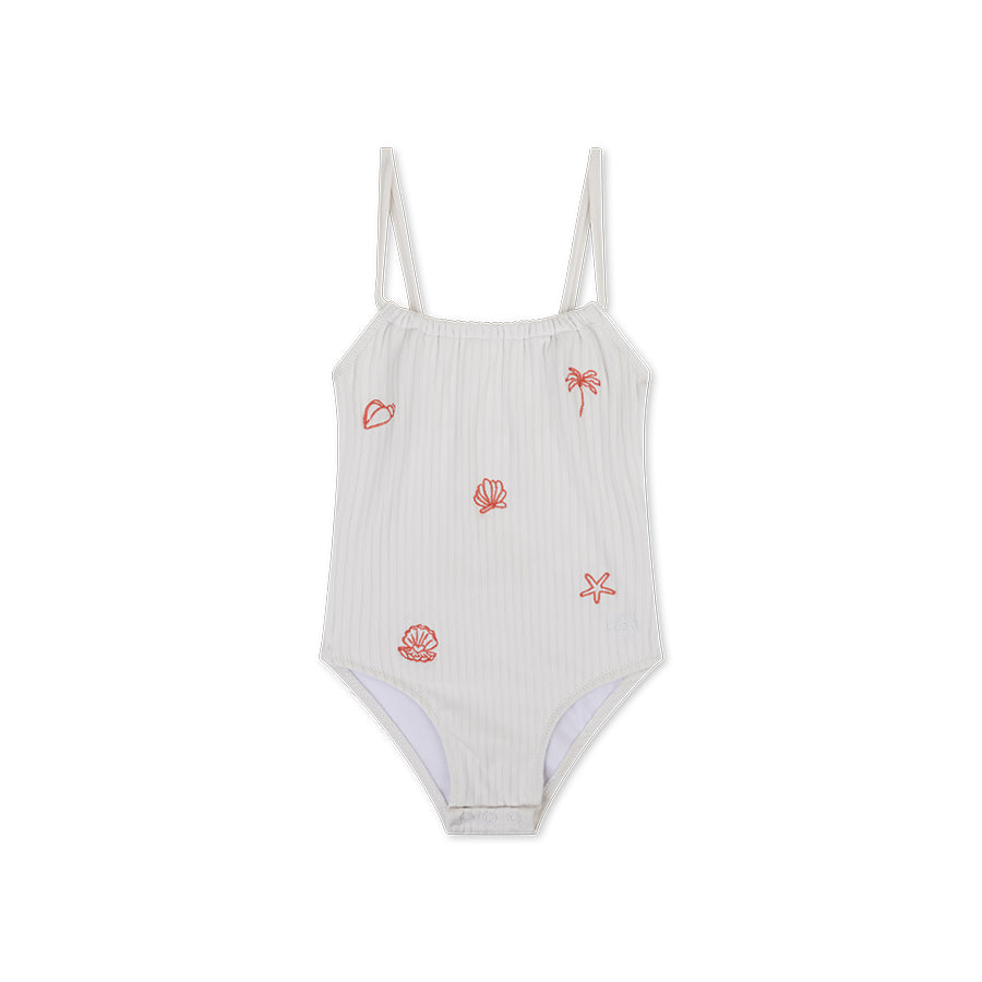 White swimsuit with red shell and palm tree patterns on a white background