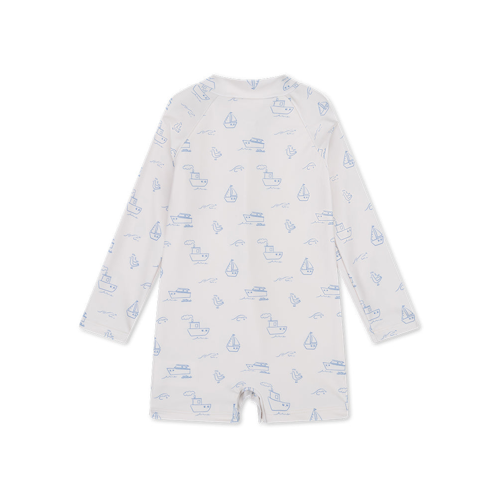 The back of a white swimsuit with blue sea prints on a white background