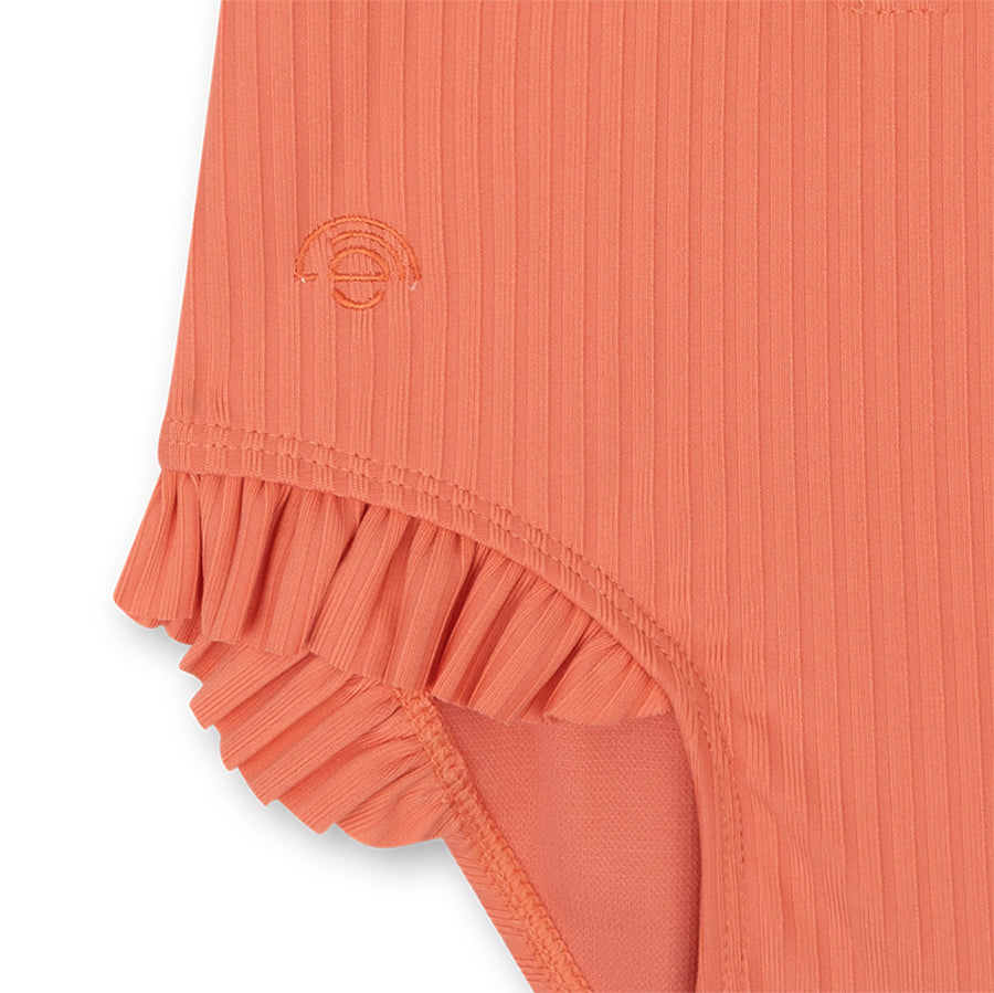 Close-up of the Pink-Bay swimsuit with ruffles on a white background